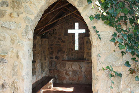 the intimate stone chapel at Ekukhanyeni, which overlooks a stunning valley below.