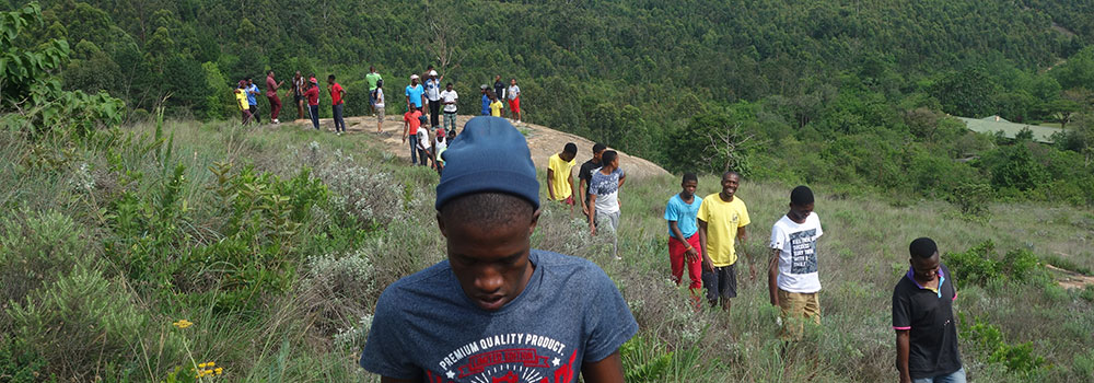 a group of people hiking at Ekukhanyeni