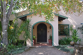 Entry to building with palms in front