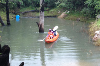 Photo of a person canoeing at Ekukhanyeni